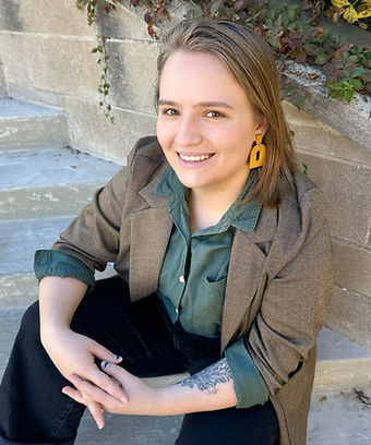 Michaela Krawczyk sitting on stone stairs
