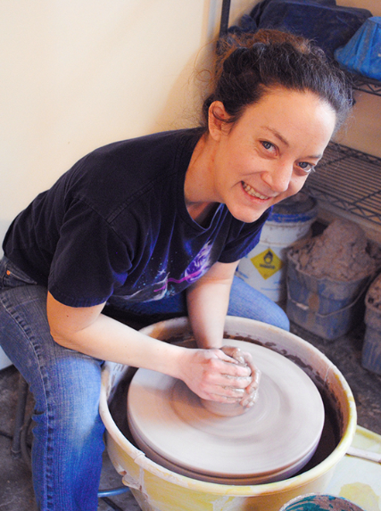 Erin O'Rear working with clay on a pottery wheel